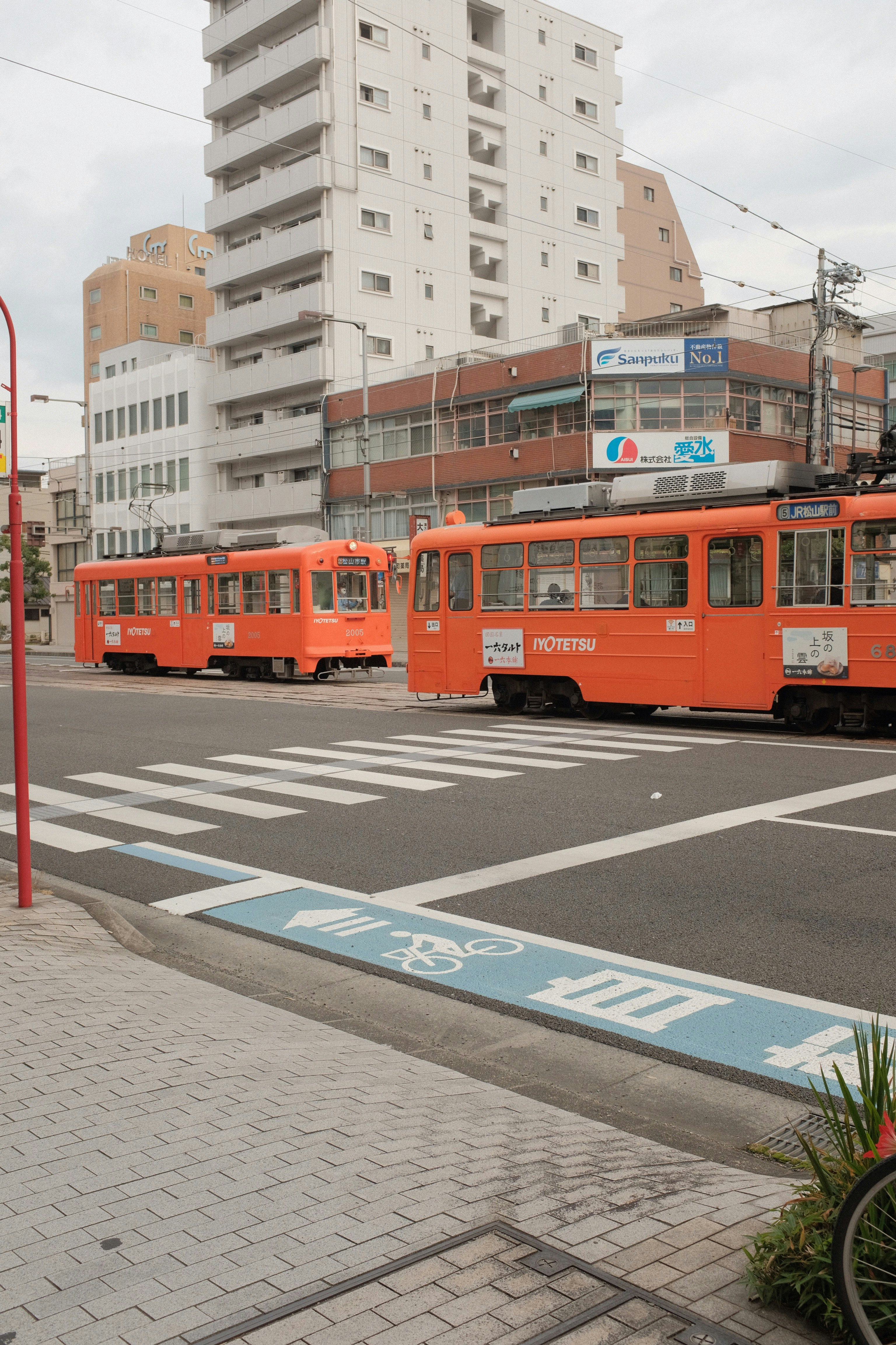 red and white tram on road during daytime